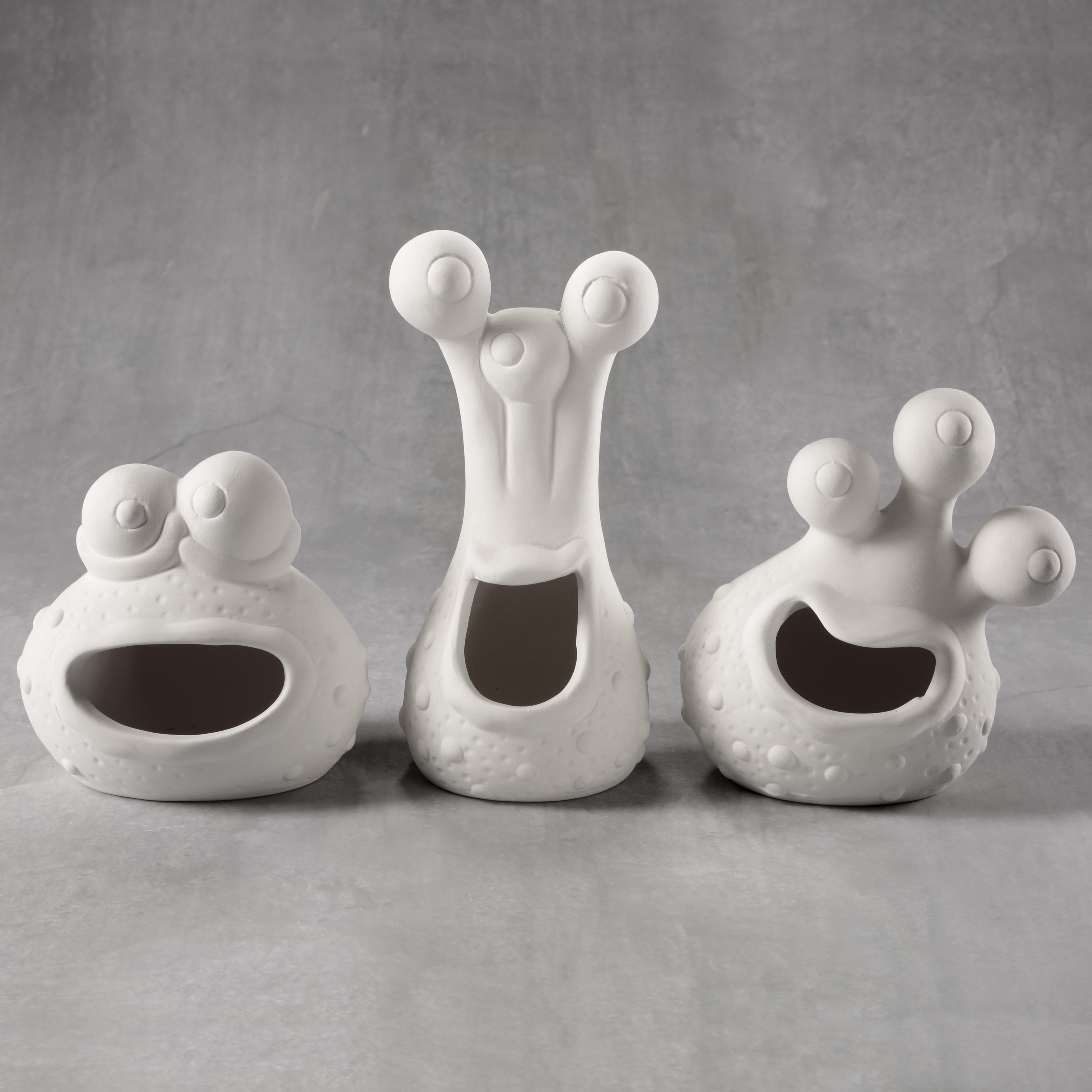 ceramic monsters Bisque Asstd. Monster Heads from Chesapeake Ceramics — Chesapeake Ceramics